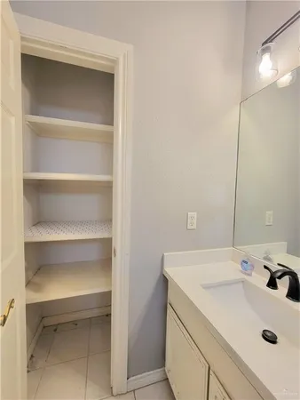a bathroom with a sink and a vanity