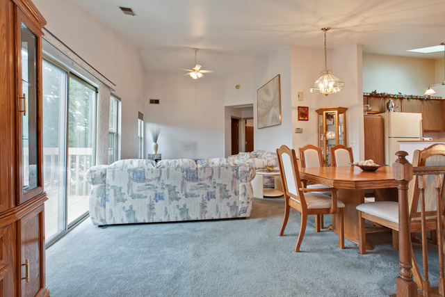 931 Ridgefield Lane Wheeling, IL 60090 - Photo 5 of 20 a living room with furniture and a chandelier