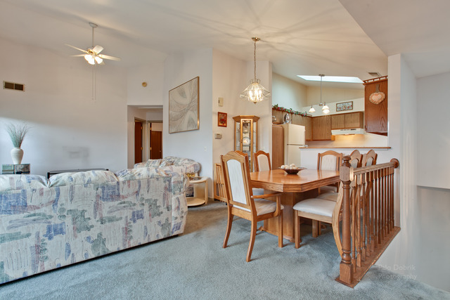 931 Ridgefield Lane Wheeling, IL 60090 - Photo 6 of 20 a view of a dining room with furniture