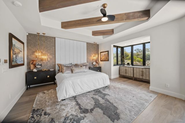 a spacious bedroom with a large bed and a view of bedroom