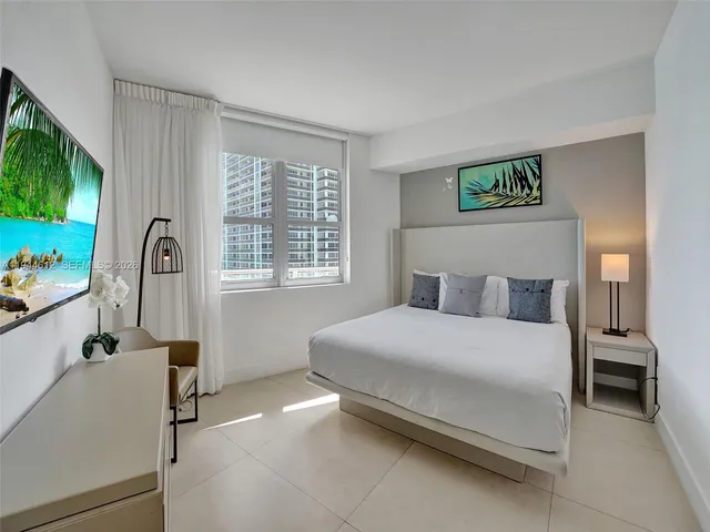 a bathroom with a sink a mirror and a shower