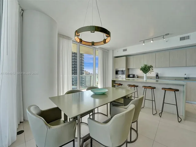 a bedroom with a bed and a lamp