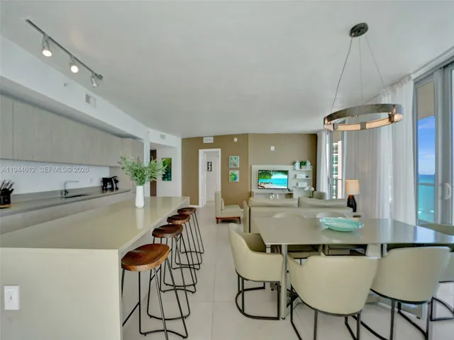 a bathroom with a shower a toilet and sink