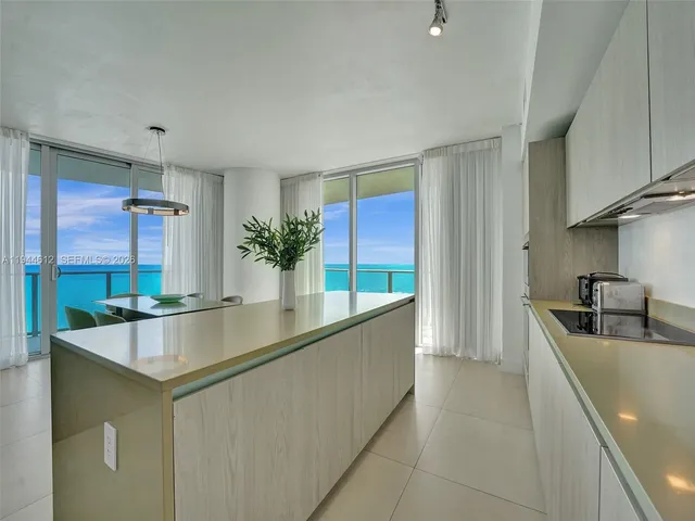 a bathroom with a toilet a sink and shower