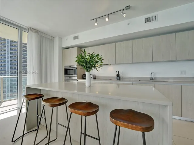 a bedroom with a bed and a lamp