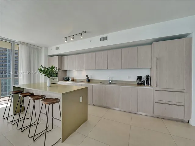 a bed room with a bed and a painting