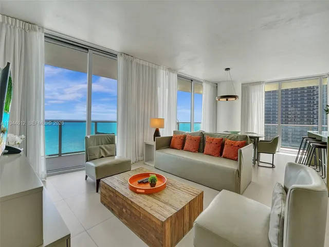 a bathroom with a granite countertop toilet a sink and a mirror