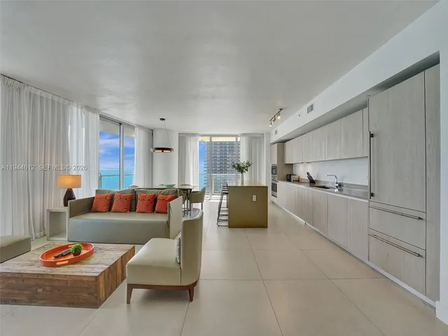 a bathroom with a double vanity sink toilet and shower