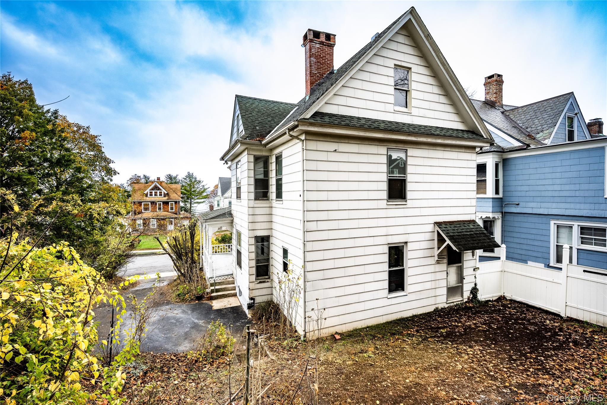 39 Hamilton Avenue Ossining, NY 10562 - Photo 17 of 22 a view of a white house with a small yard and large tree
