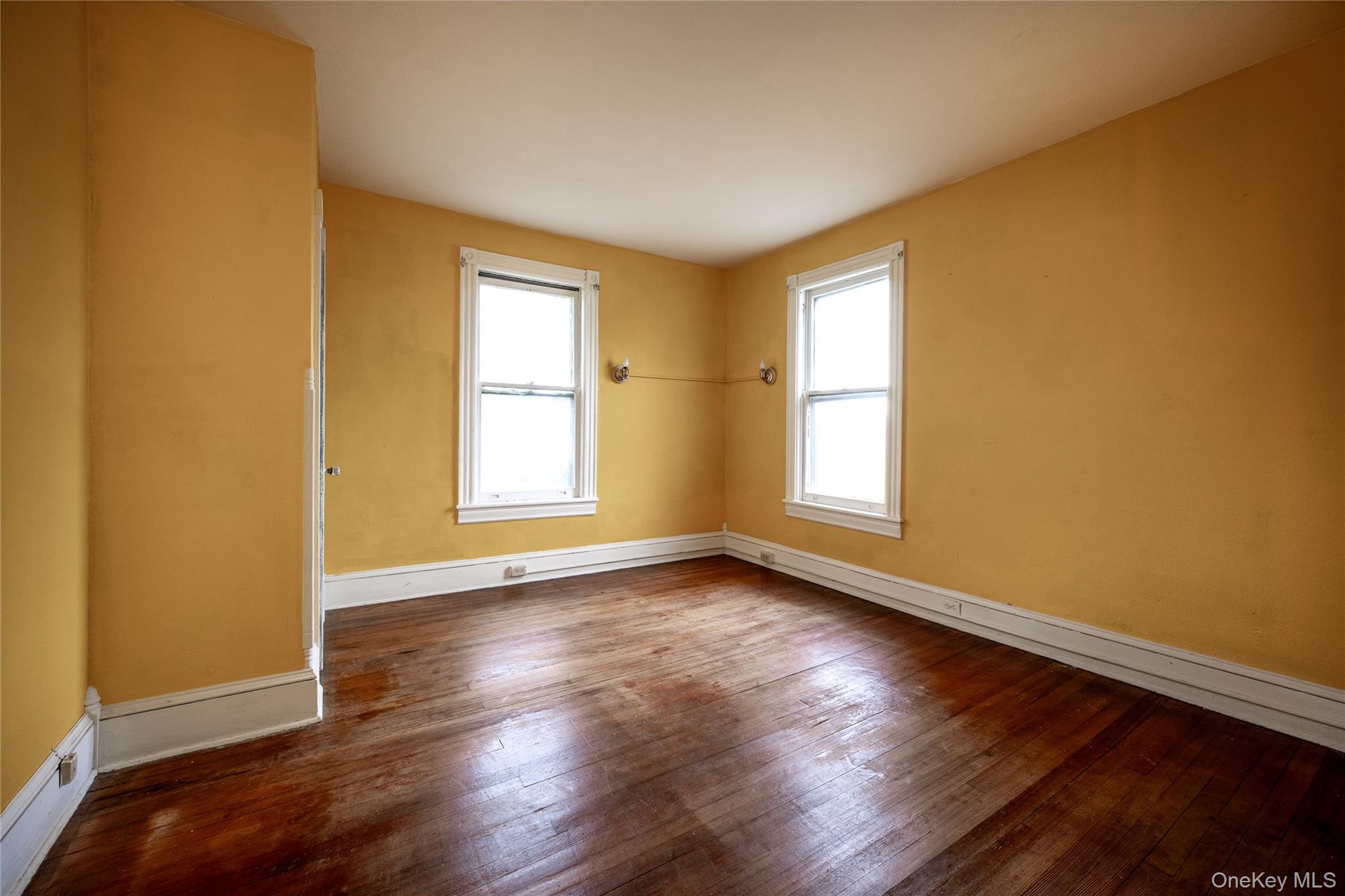 39 Hamilton Avenue Ossining, NY 10562 - Photo 10 of 22 a view of an empty room with wooden floor and a window