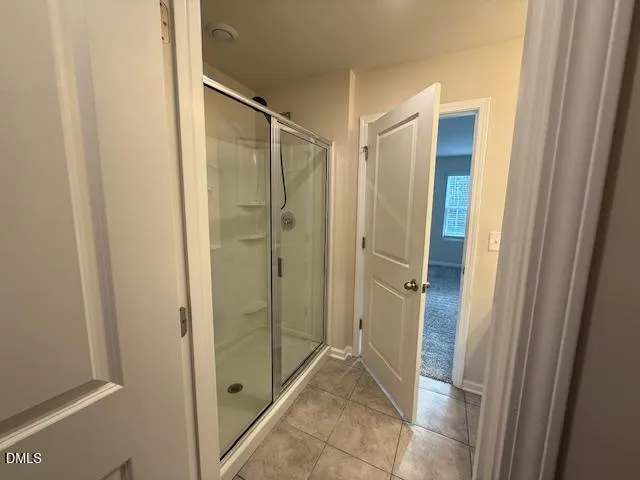 a spacious bathroom with a double vanity sink and a mirror