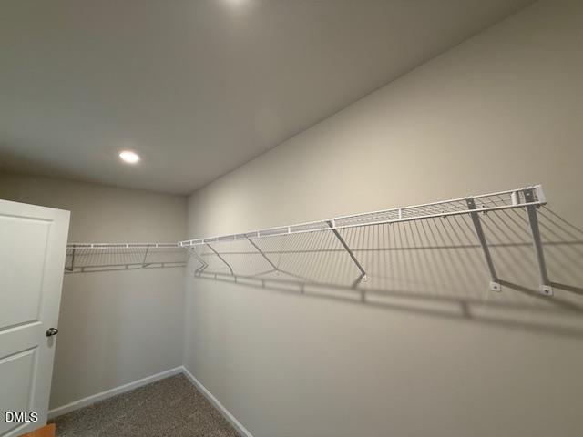 212 Brook Farm Lane Fuquay-Varina, NC 27526 - Photo 19 of 23 a view of a room with racks on the wall