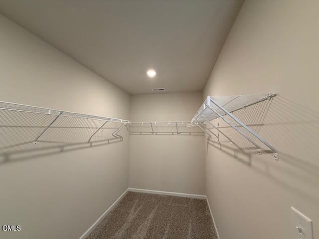 212 Brook Farm Lane Fuquay-Varina, NC 27526 - Photo 20 of 23 a view of a room with racks on the wall