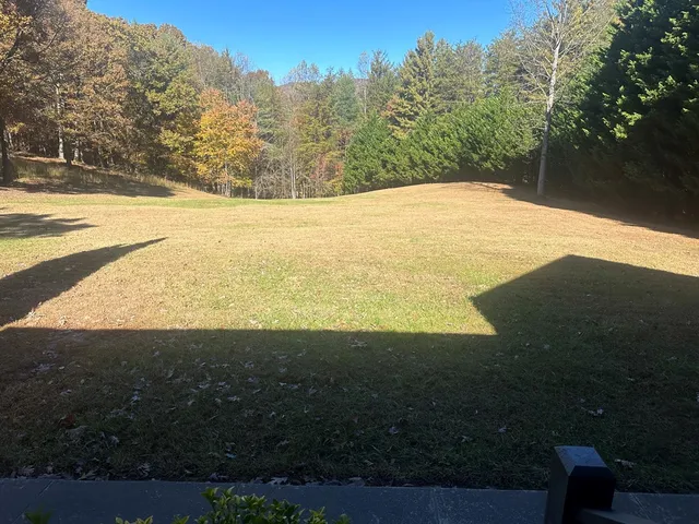 a kitchen with a dining table chairs sink and refrigerator