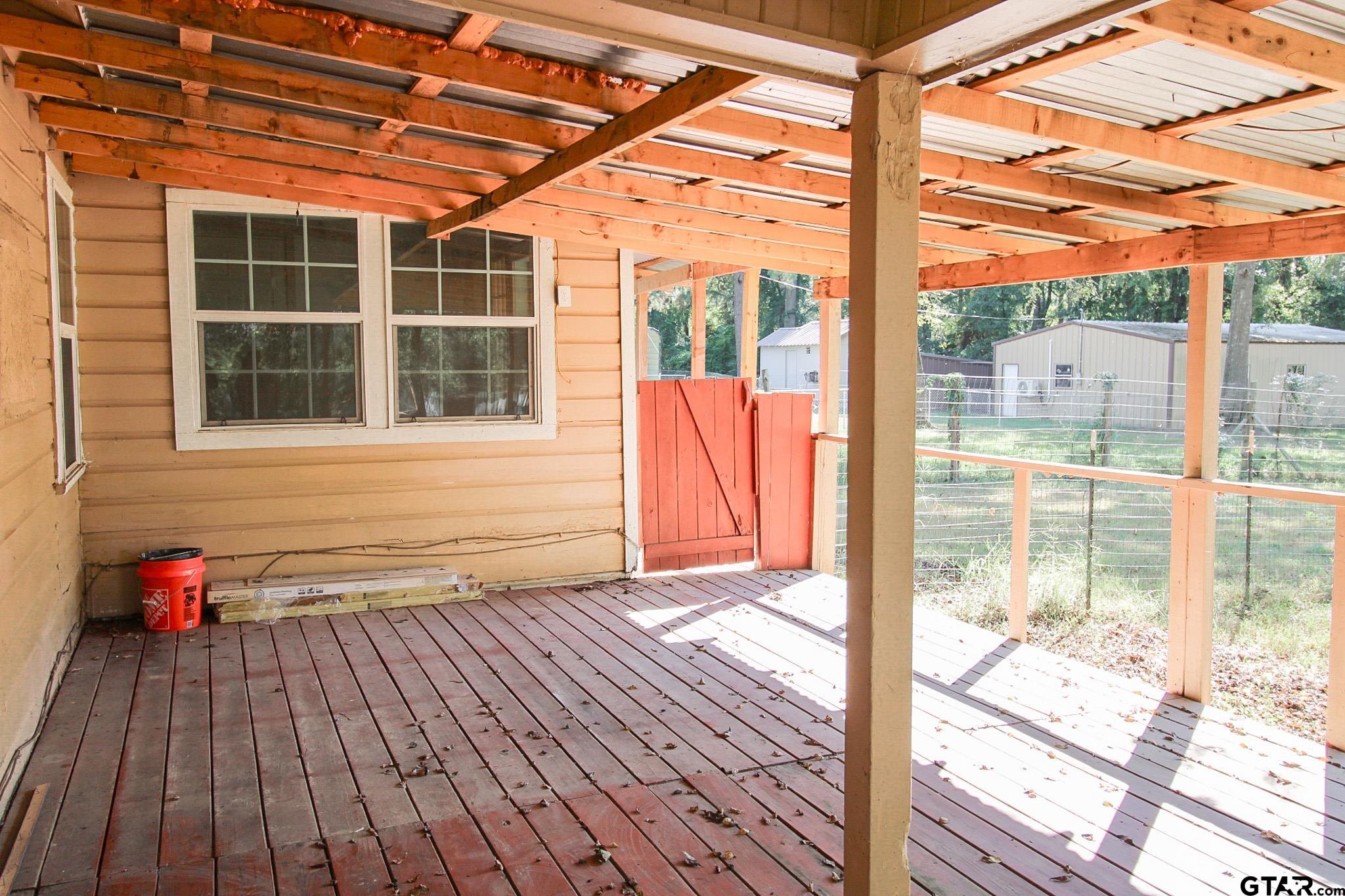 407 Pace Street Naples, TX 75568 - Photo 25 of 31 a view of porch with wooden floor and city view