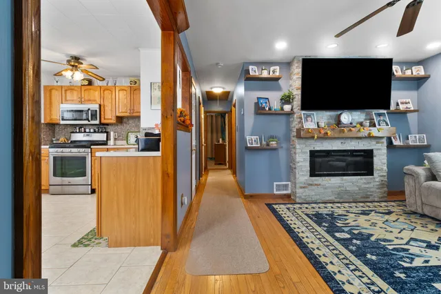 a view of a living room with a flat screen tv and outdoor view