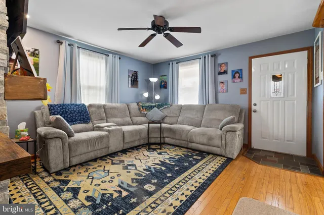 a living room with furniture and a rug