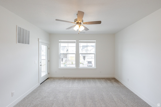 675 West 4500th South, Unit P302 Mapleton, UT 84664 - Photo 14 of 16 Neutral-toned carpeting complements the white walls and trim throughout this space