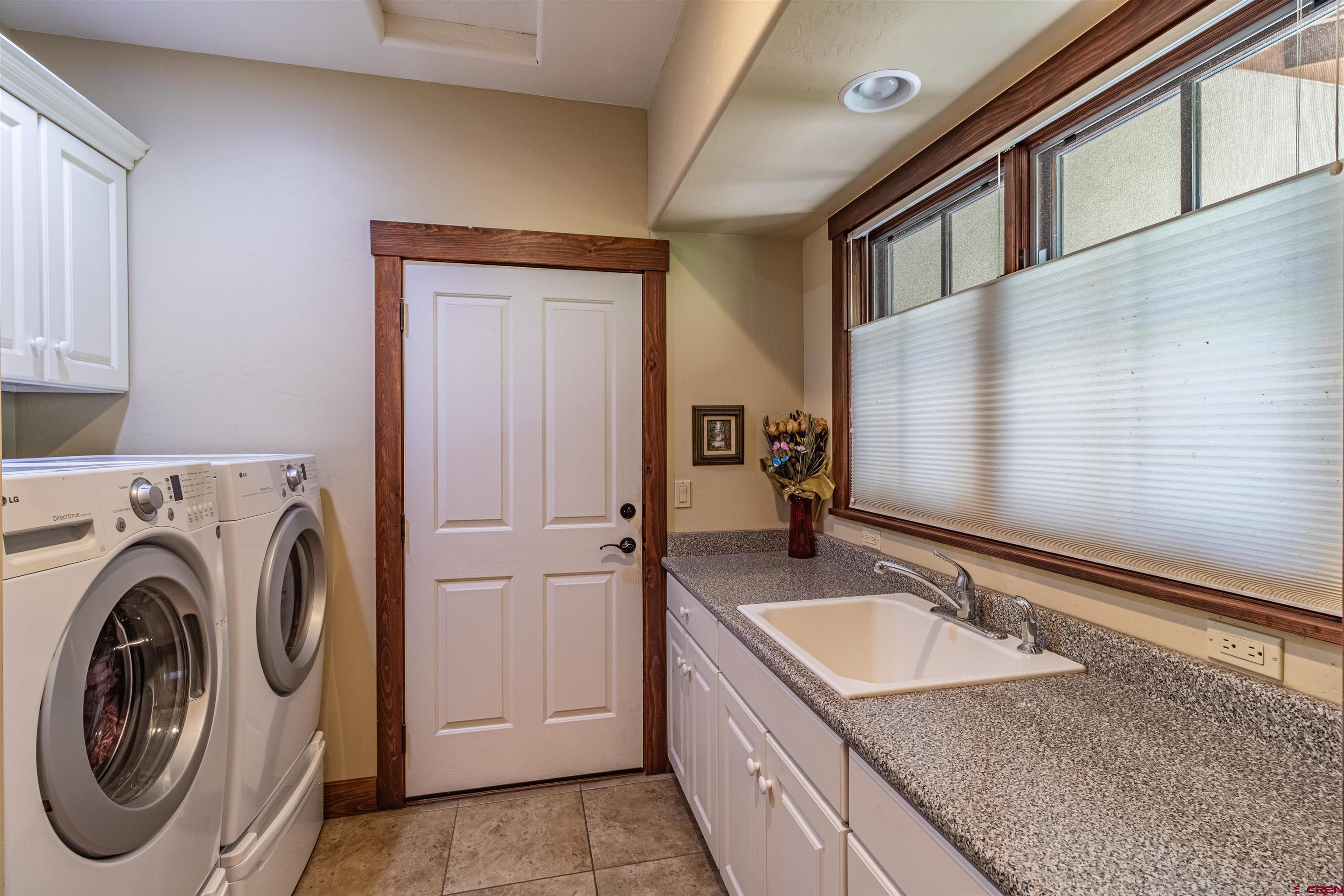 1167 North Dalton Ranch Road Durango, CO 81301 - Photo 32 of 45 a bathroom with a sink and a mirror