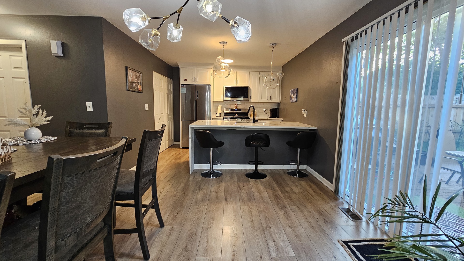 16 Forest Lane Cary, IL 60013 - Photo 16 of 50 a view of a dining room with furniture window and wooden floor