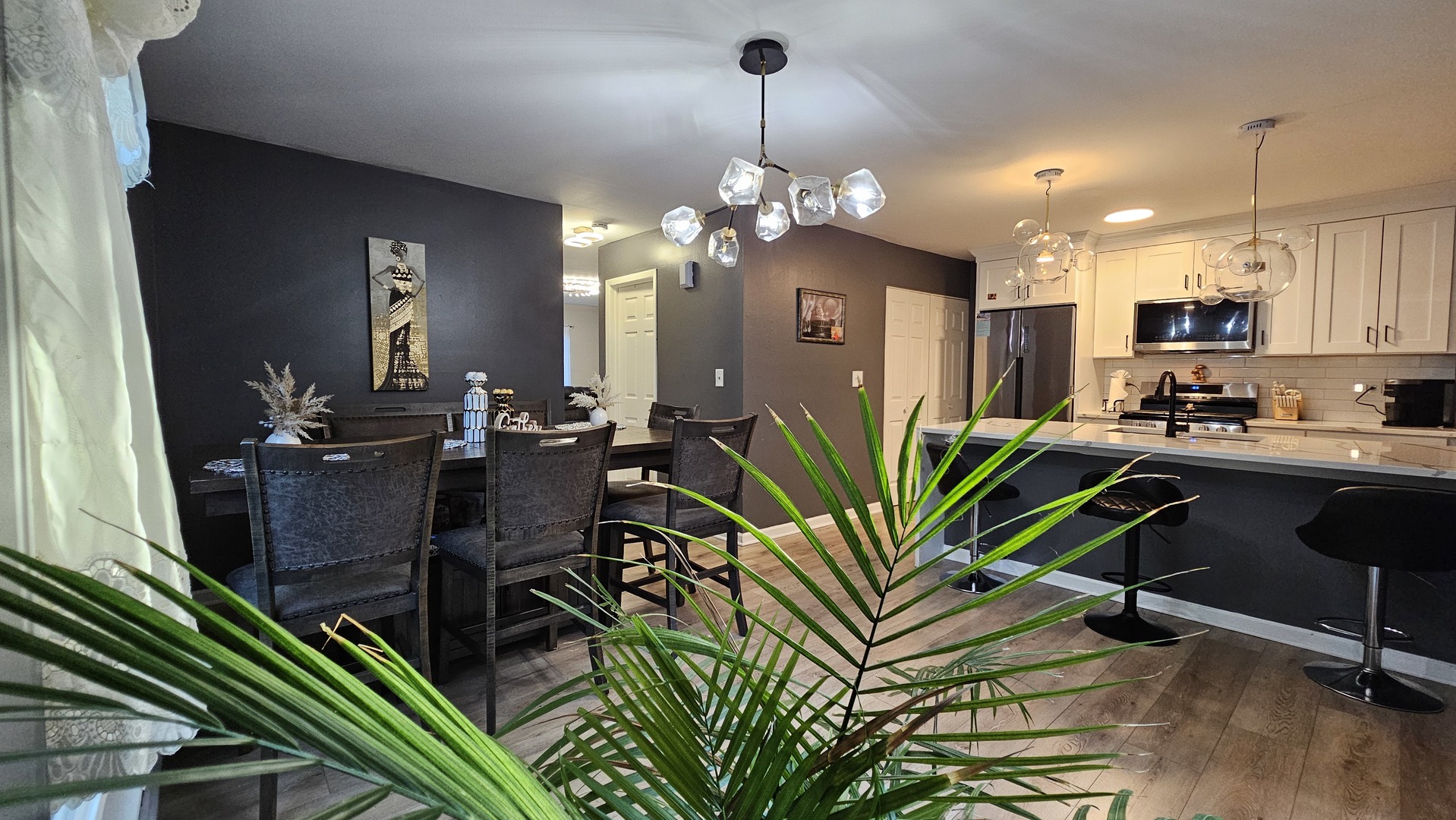 16 Forest Lane Cary, IL 60013 - Photo 18 of 50 an open kitchen with dining table and chairs