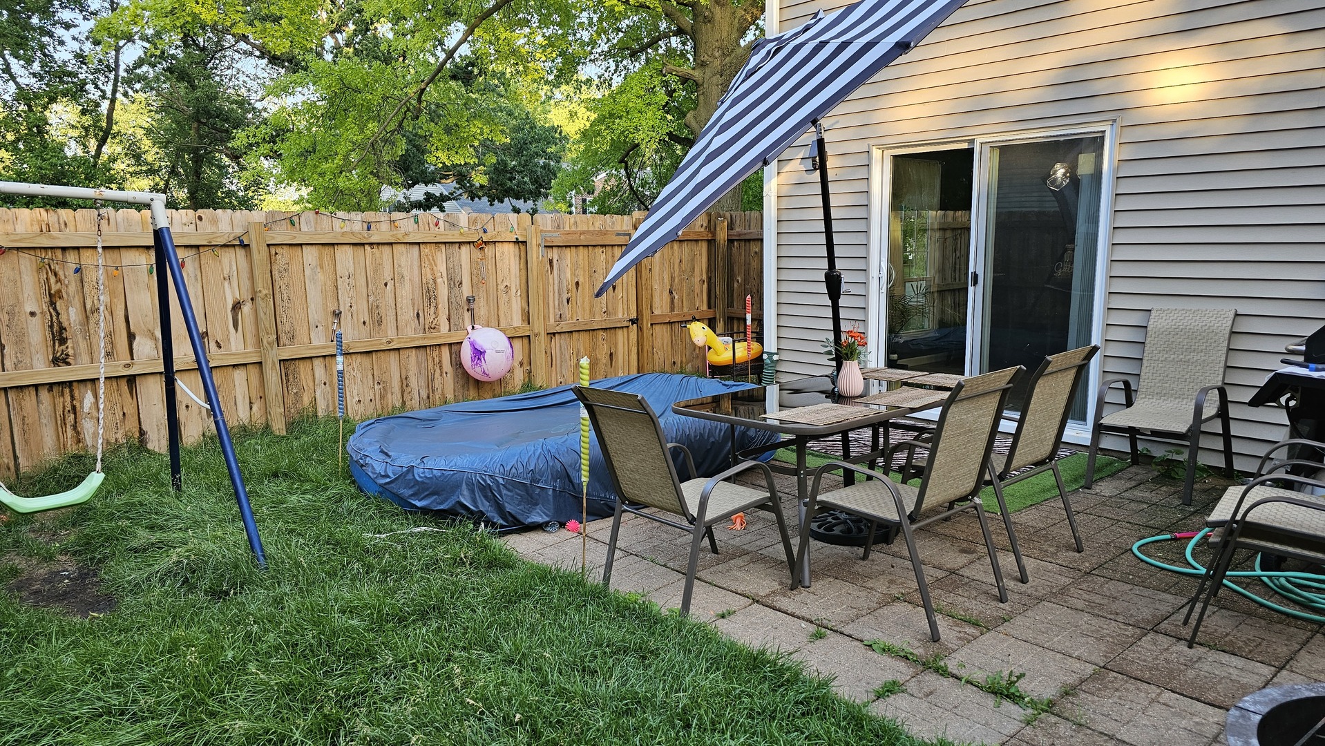 16 Forest Lane Cary, IL 60013 - Photo 25 of 50 a backyard of a house with table and chairs