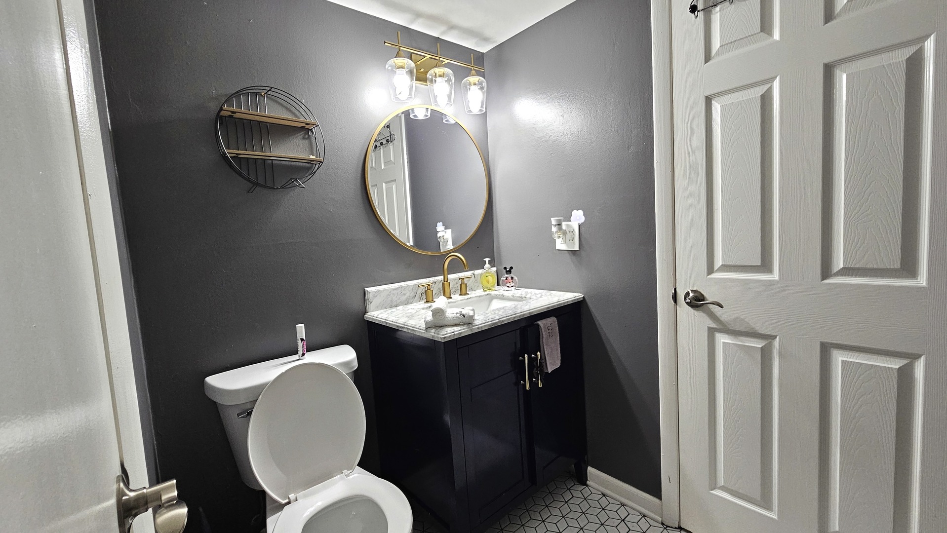 16 Forest Lane Cary, IL 60013 - Photo 29 of 50 a bathroom with a toilet a sink and a mirror