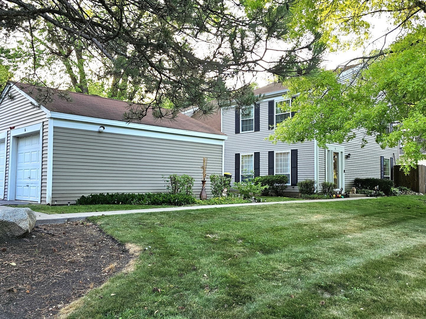 16 Forest Lane Cary, IL 60013 - Photo 3 of 50 a front view of a house with a yard