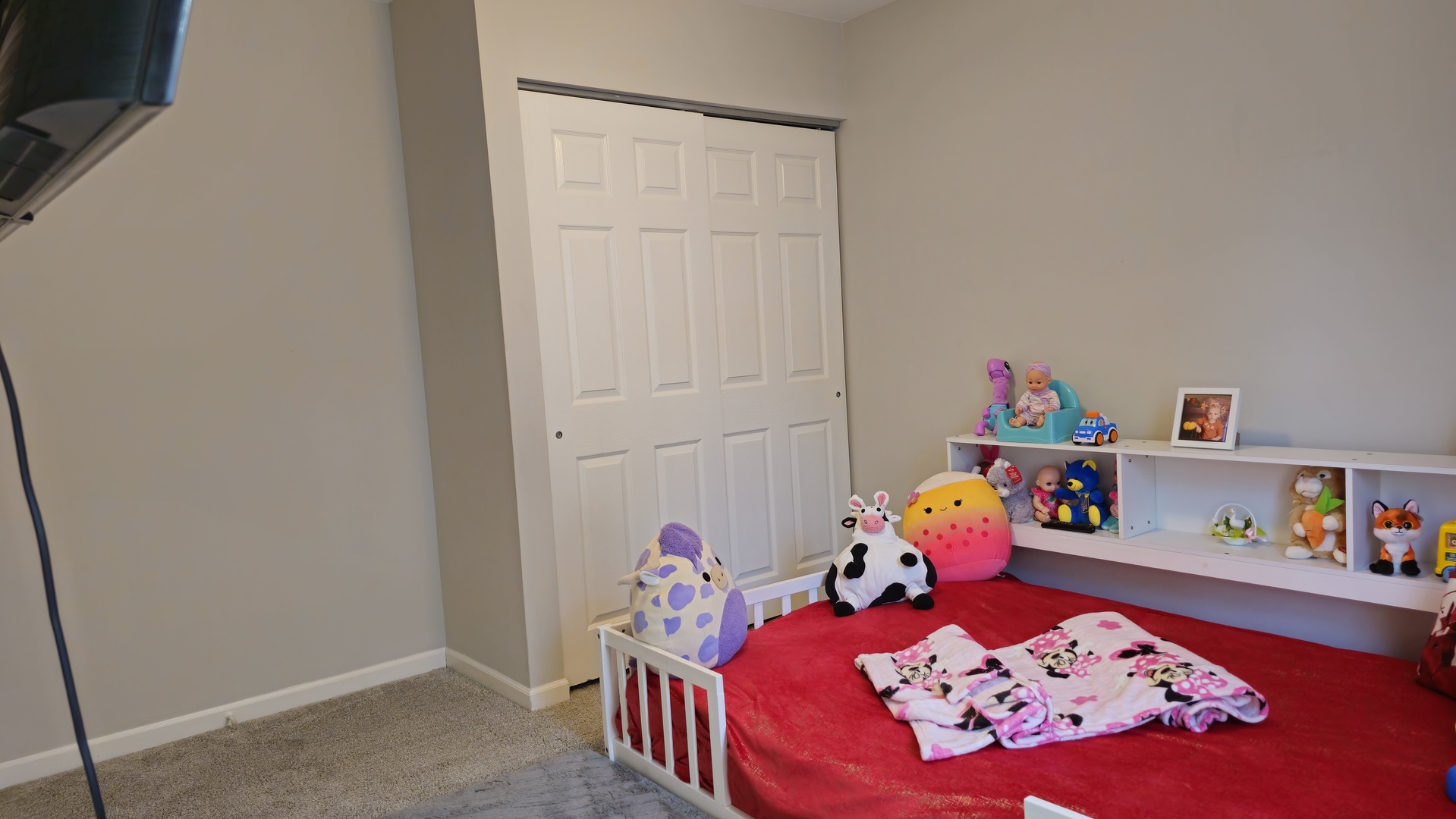 16 Forest Lane Cary, IL 60013 - Photo 34 of 50 a bedroom with baby toys and a wooden floor