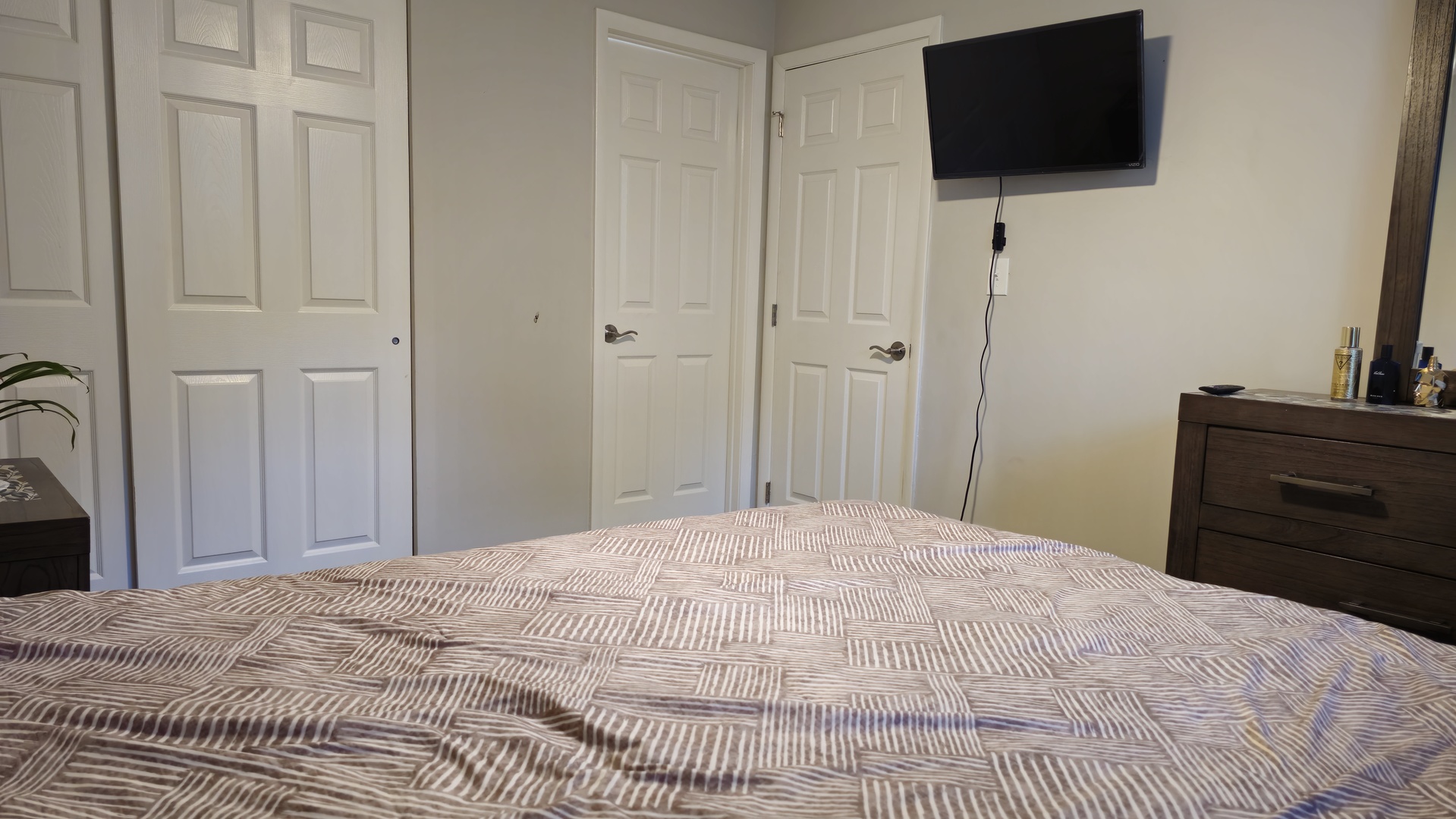 16 Forest Lane Cary, IL 60013 - Photo 47 of 50 a bedroom with a bed and a flat tv screen on dresser