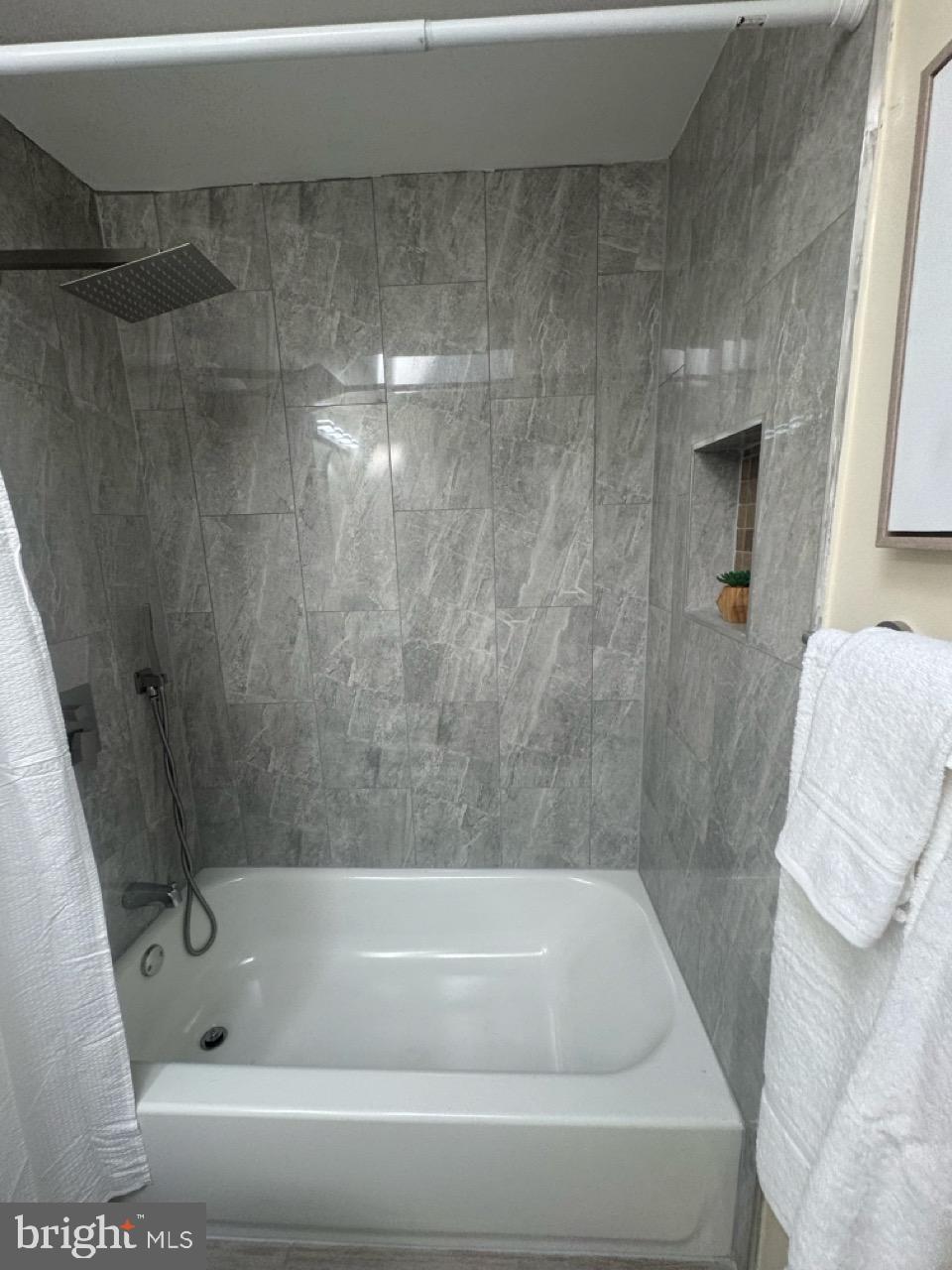 1231 Kevin Road Baltimore, MD 21229 - Photo 20 of 28 Modern bathroom with elegant tile design.