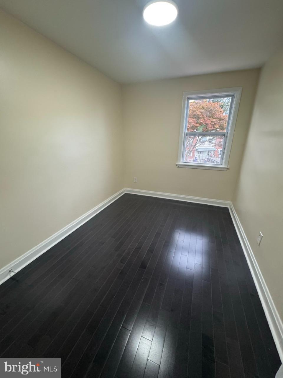1231 Kevin Road Baltimore, MD 21229 - Photo 22 of 28 Bright and airy room with sleek flooring.