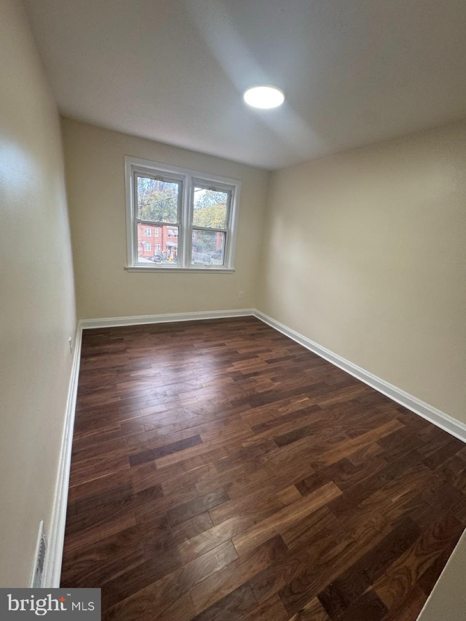 1231 Kevin Road Baltimore, MD 21229 - Photo 23 of 28 Bright and airy room with warm wood floors.