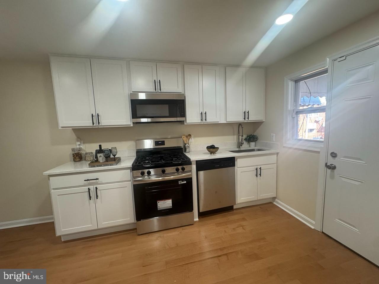 1231 Kevin Road Baltimore, MD 21229 - Photo 9 of 28 Modern kitchen with sleek cabinetry.