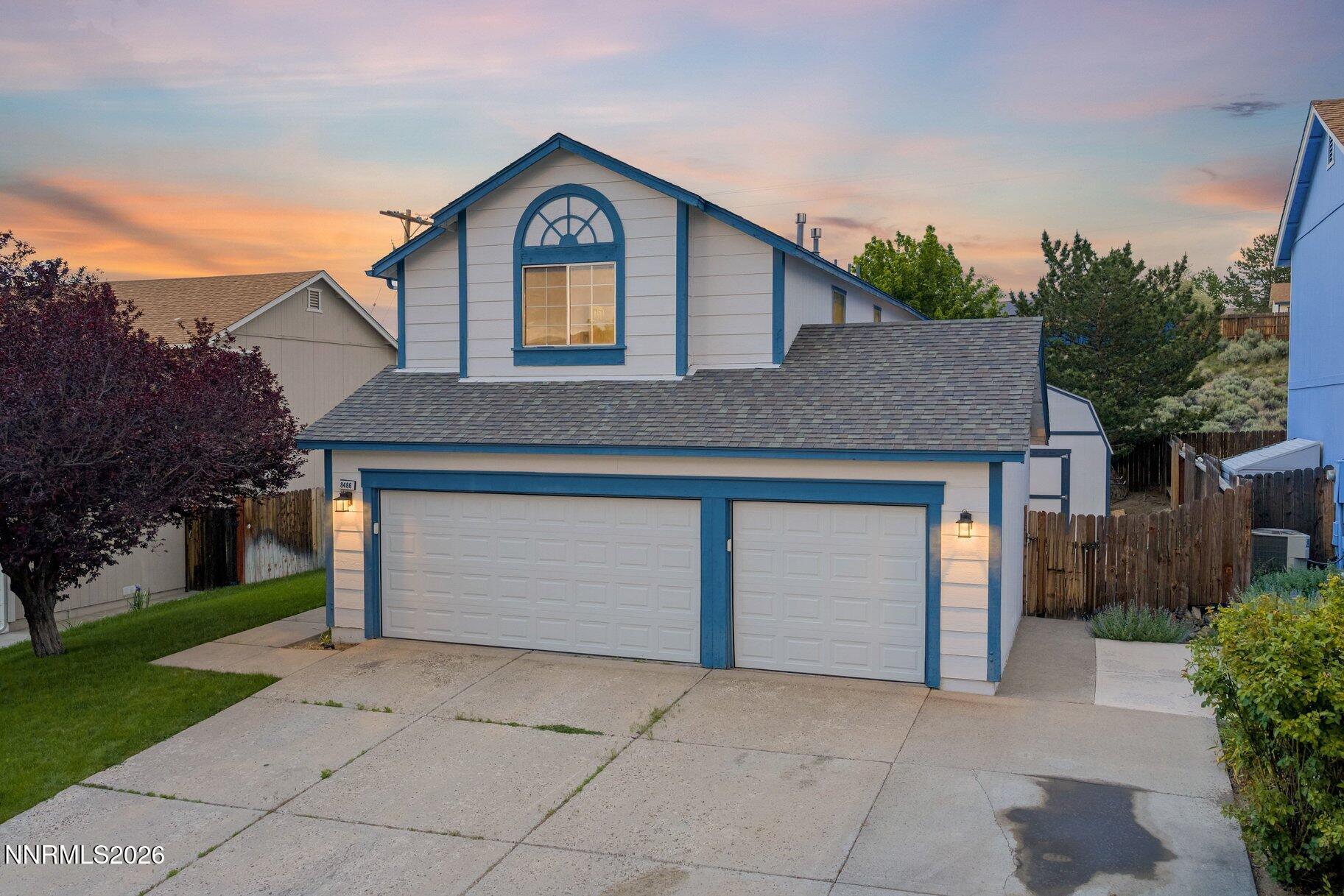 8486 Piper Place Reno, NV 89506 - Photo 56 of 80 a front view of a house with garden