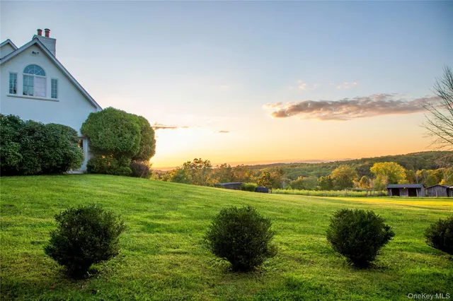 a view of a garden with a building in the background