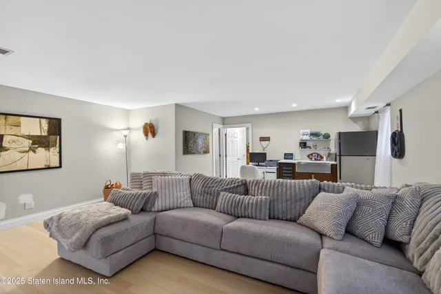 a bathroom with a sink mirror and toilet