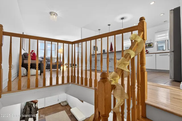 a kitchen with kitchen island white cabinets sink and stove