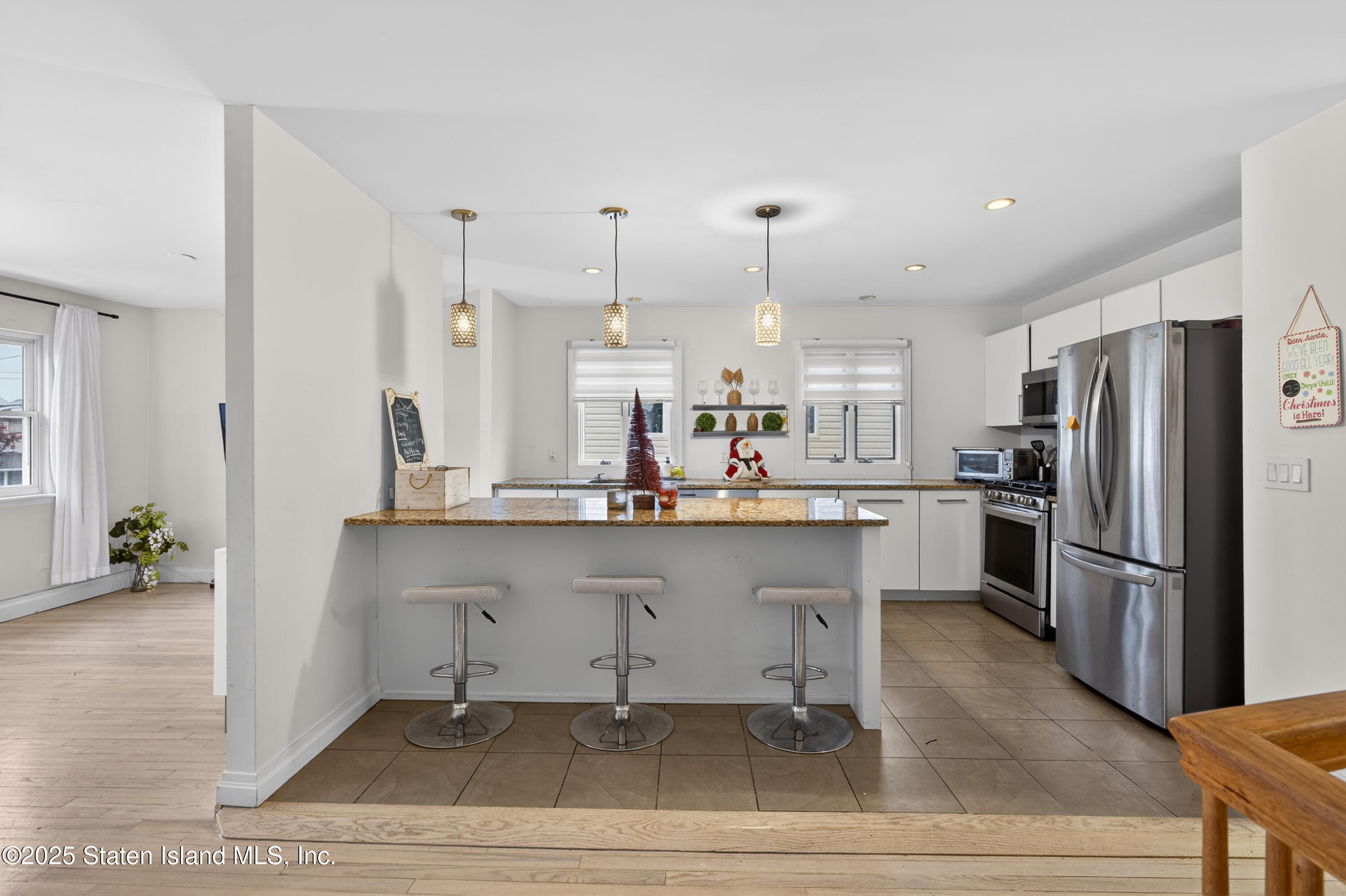 70 Annadale Road Staten Island, NY 10312 - Photo 18 of 35 a kitchen with stainless steel appliances kitchen island granite countertop a refrigerator and a sink