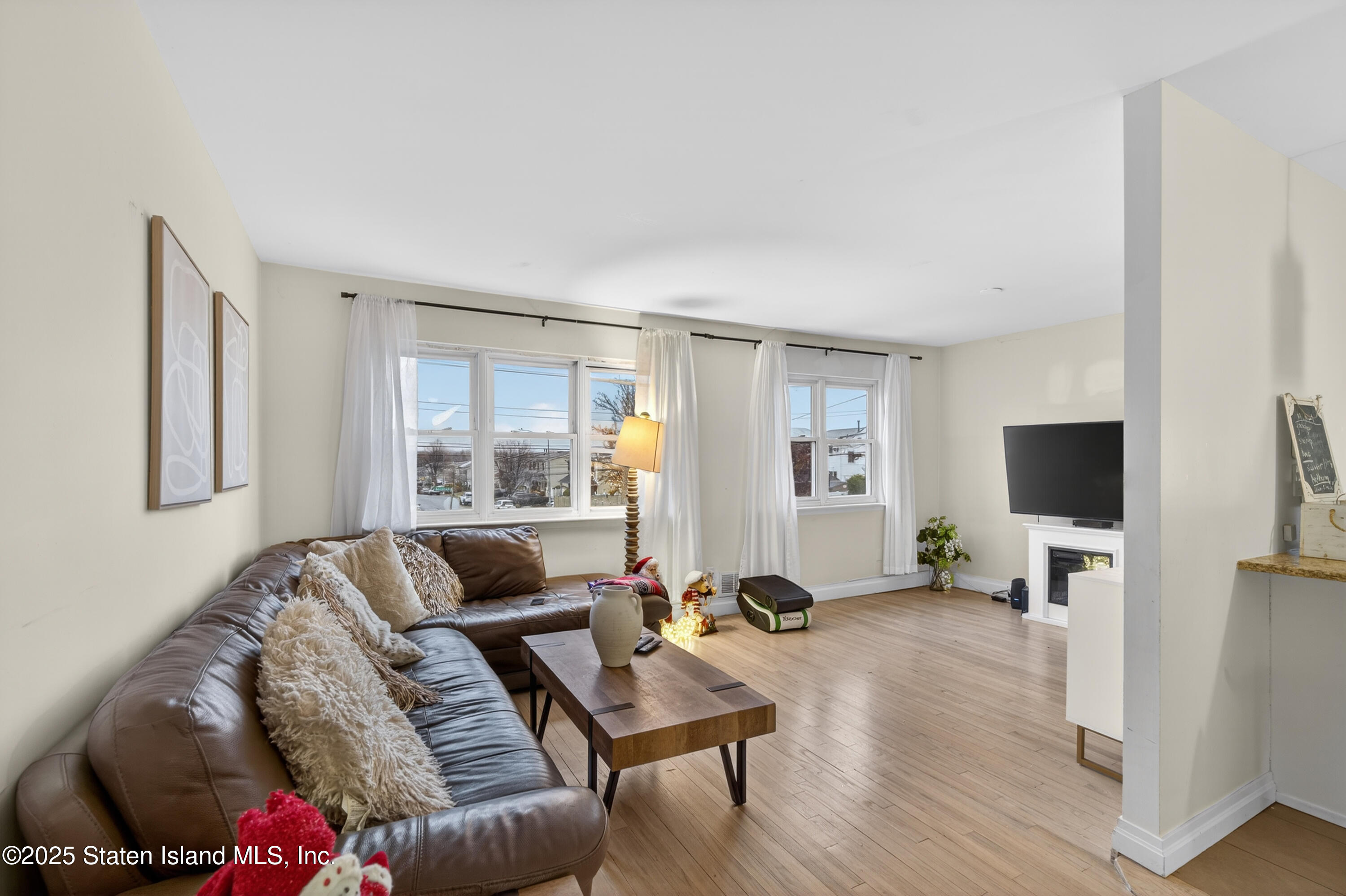 70 Annadale Road Staten Island, NY 10312 - Photo 19 of 35 a living room with furniture and a flat screen tv