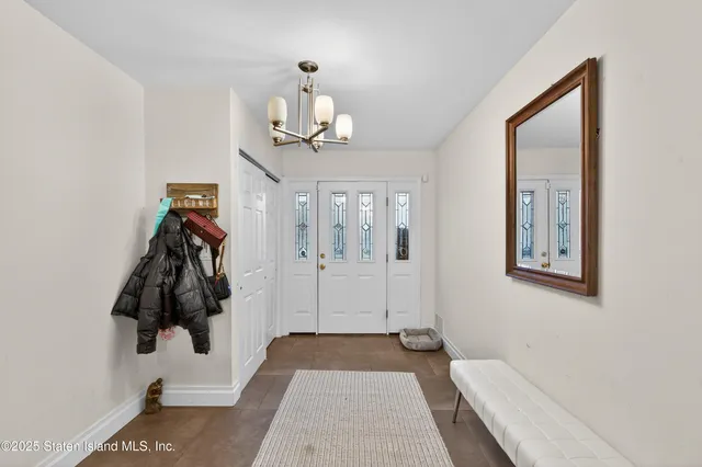 a bedroom with a bed and a lamp on the table