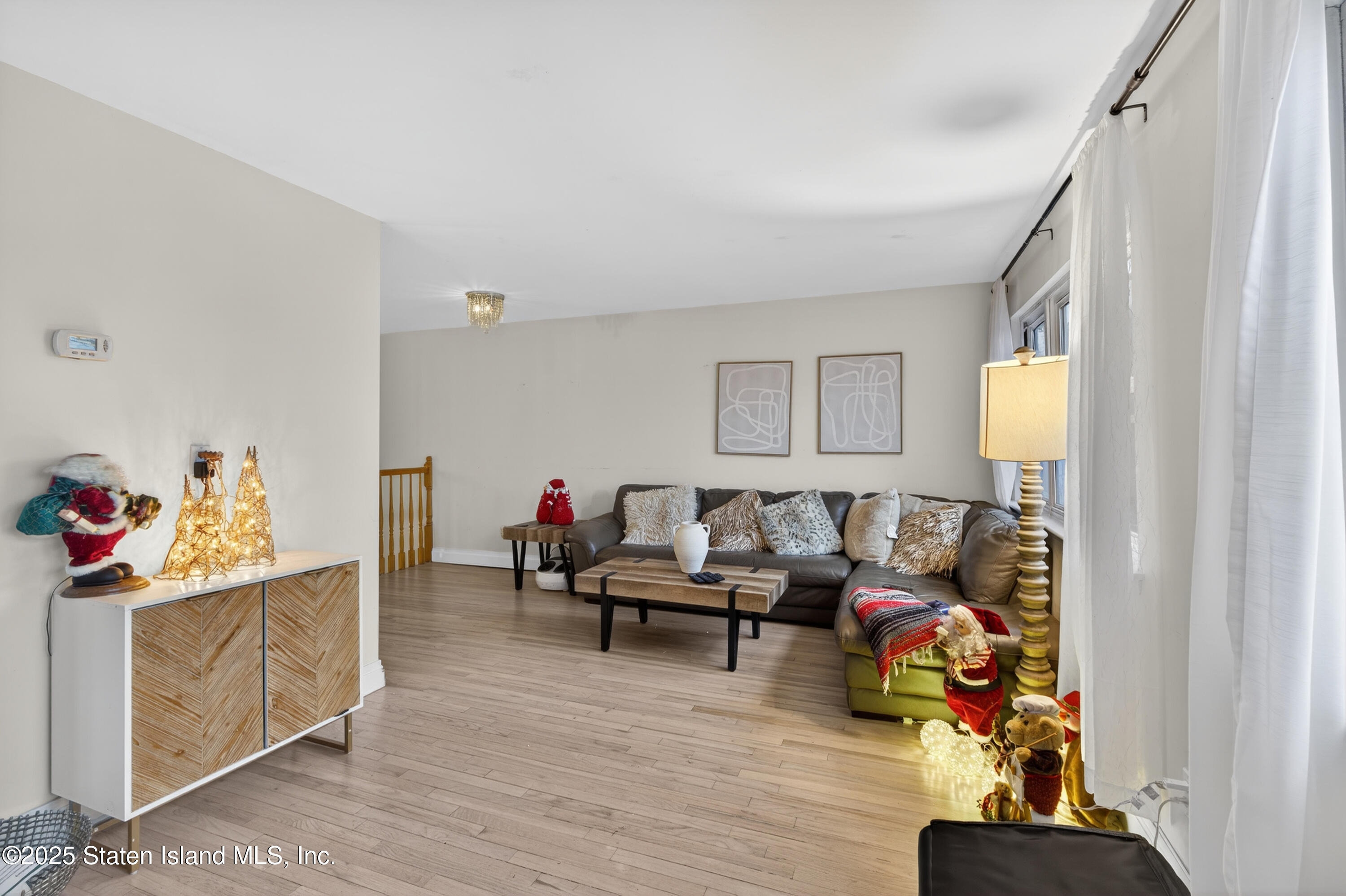 70 Annadale Road Staten Island, NY 10312 - Photo 22 of 35 a living room with furniture and a wooden floor