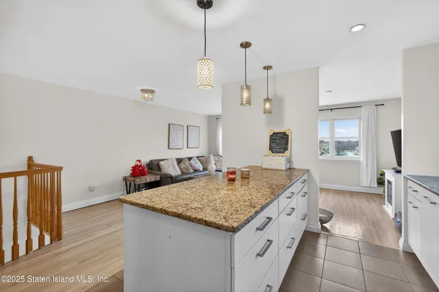 a large bed sitting in a bedroom and a table