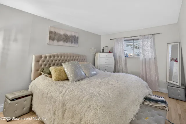 a view of kitchen with furniture and wooden floor