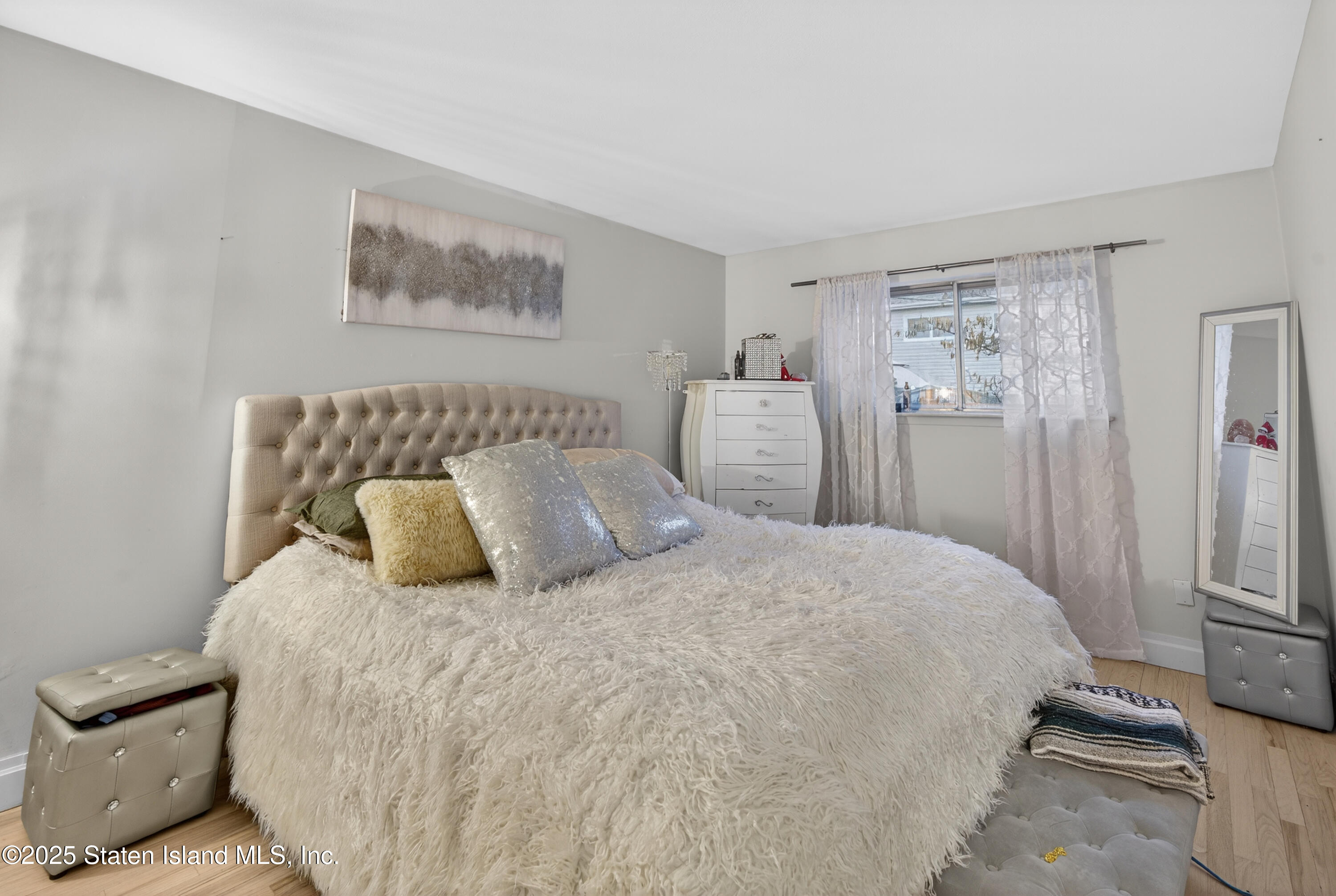 70 Annadale Road Staten Island, NY 10312 - Photo 29 of 35 a large bed sitting in a bedroom and a table