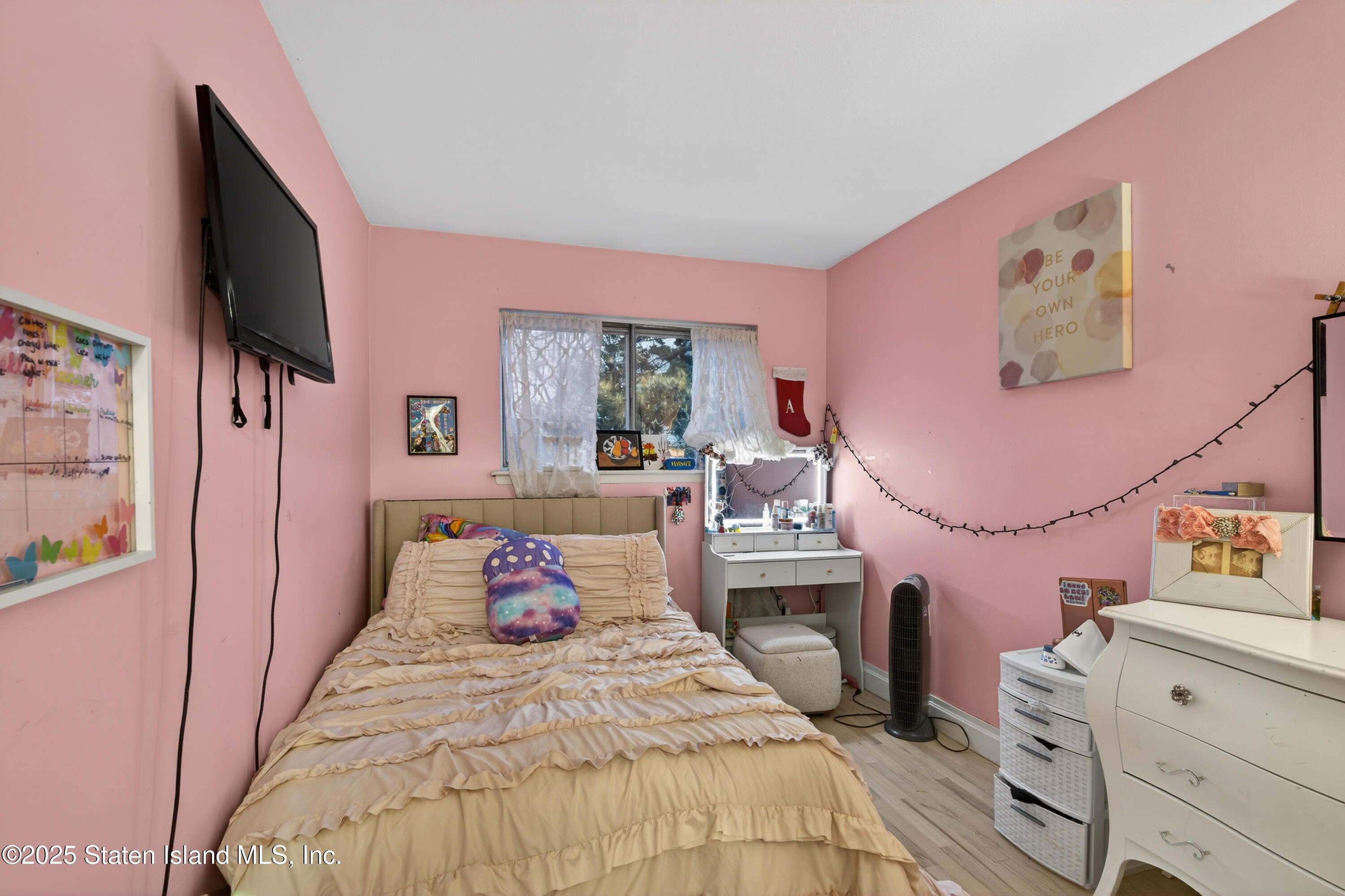 70 Annadale Road Staten Island, NY 10312 - Photo 31 of 35 a bedroom with a bed and flat screen tv