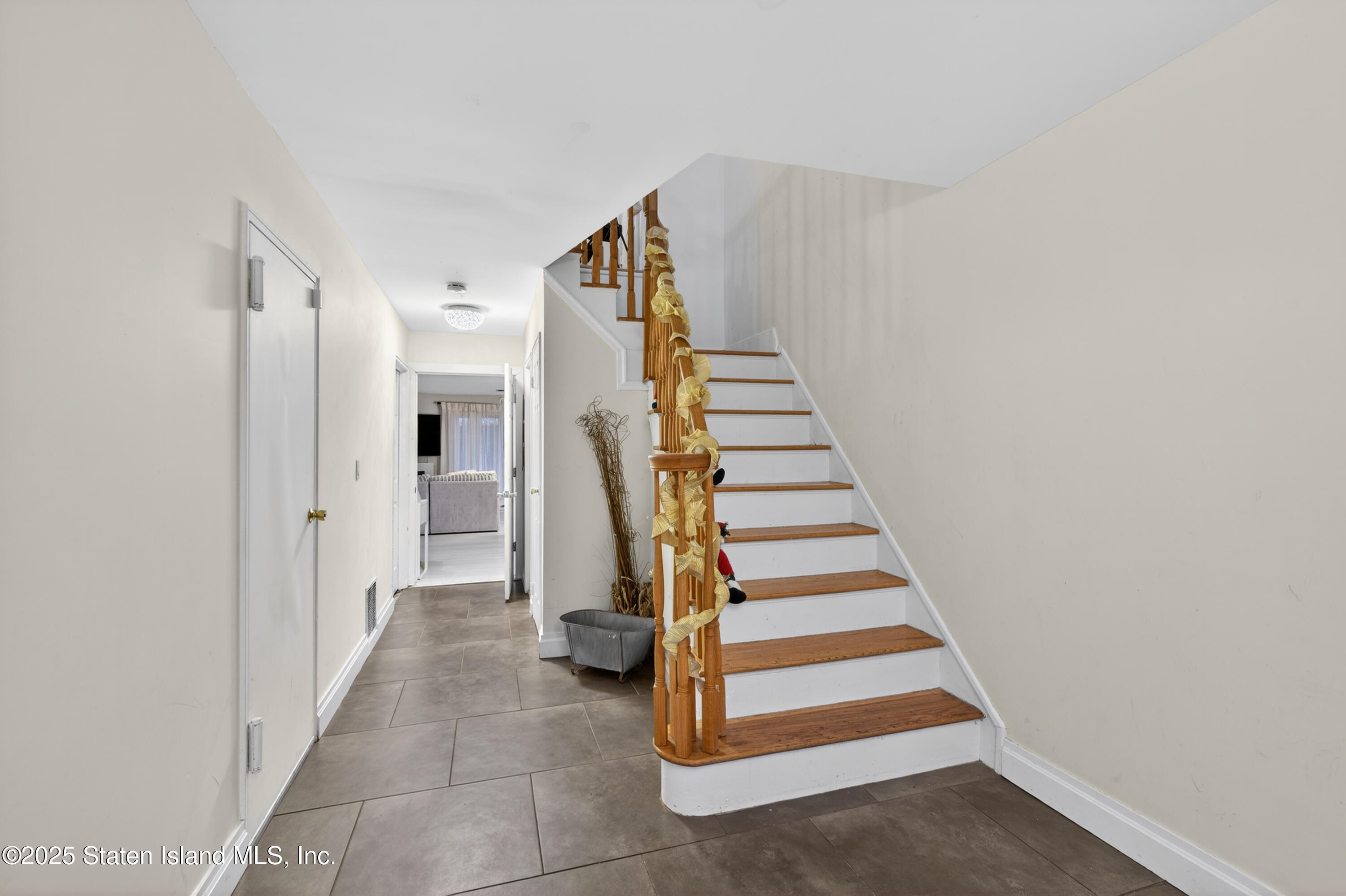 70 Annadale Road Staten Island, NY 10312 - Photo 4 of 35 a view of a hallway with entryway and stairs