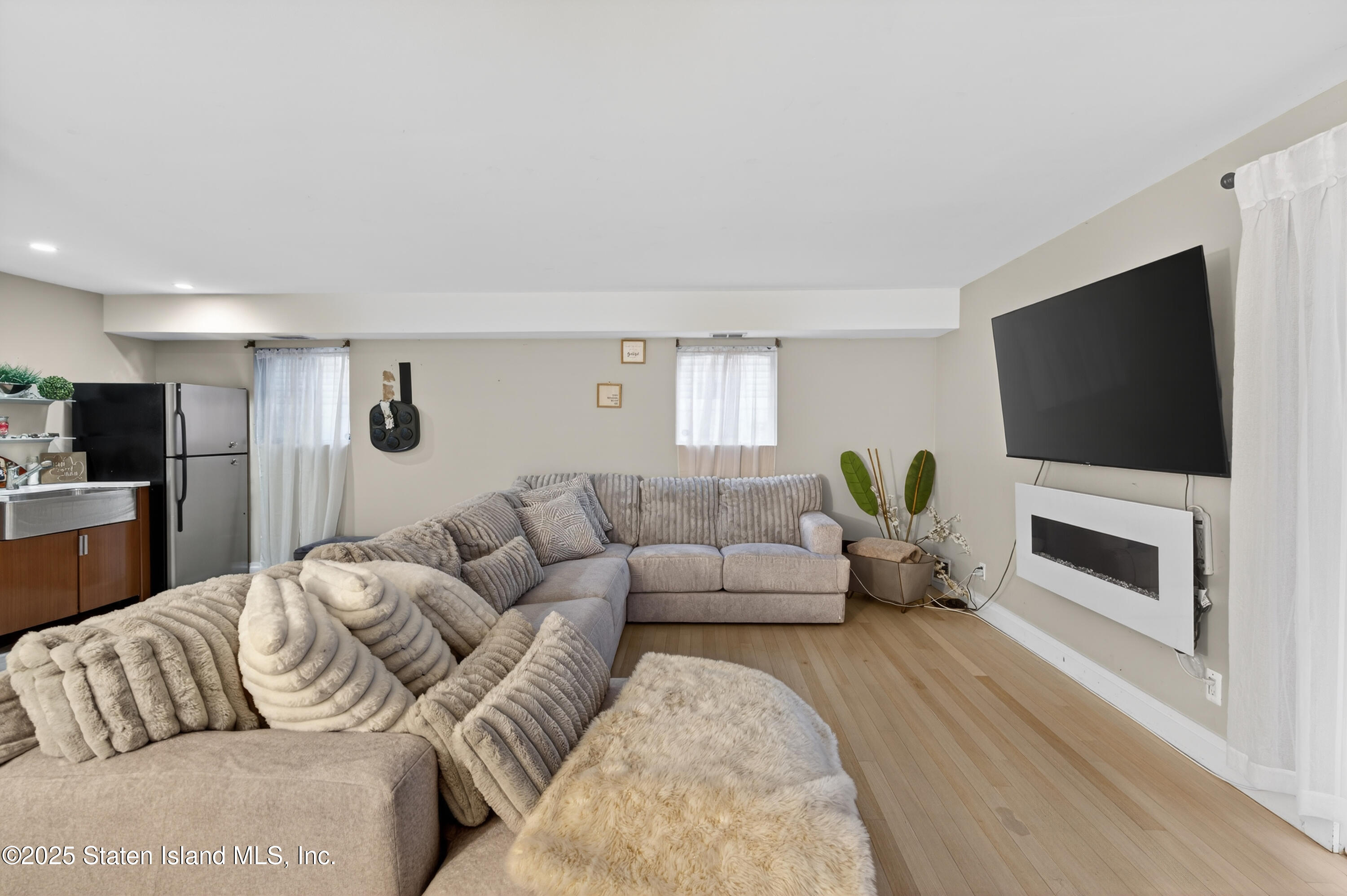 70 Annadale Road Staten Island, NY 10312 - Photo 10 of 35 a living room with furniture and a flat screen tv