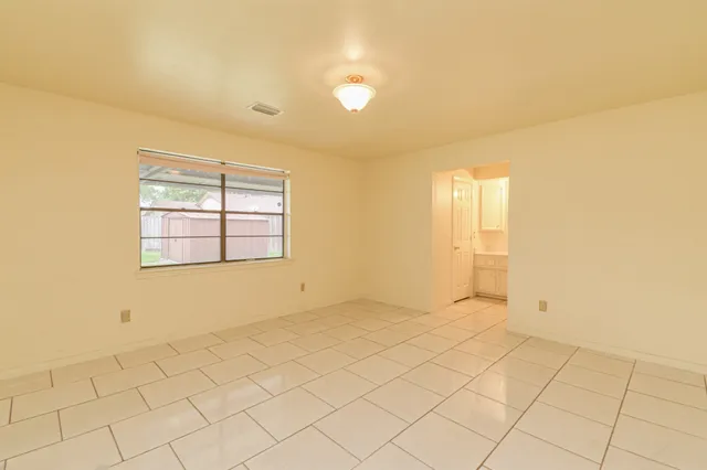 a bathroom with a sink vanity mirror and toilet