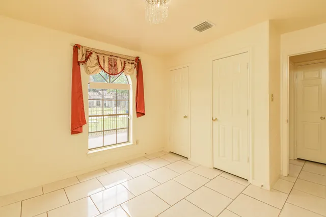 a view of an empty room and window